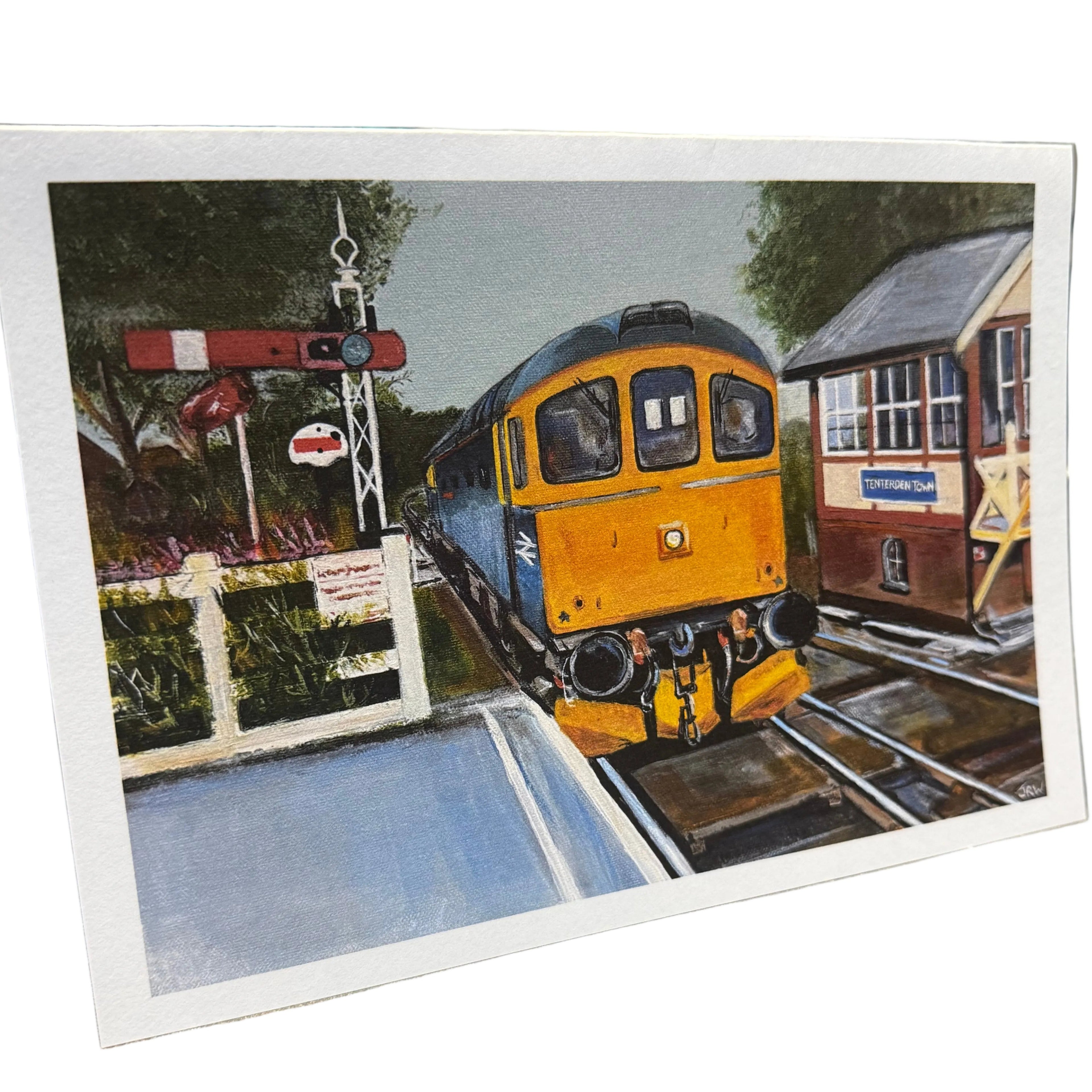 Colourful Class 33 diesel train passing Tenterden signal box